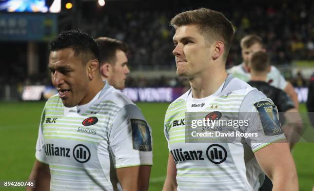 Owen Farrell, the Saracens captain, walks off the field with team mate Mako Vunipola after a his sides narrow defeat during the European Rugby...