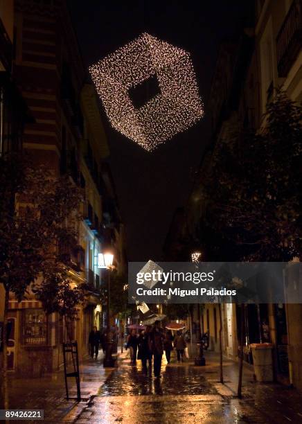 Madrid In the image, Christmas lighting of the street Huertas.