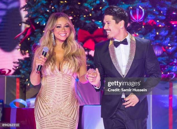 Mariah Carey and Bryan Tanaka perform live on stage at The O2 Arena on December 11, 2017 in London, England.