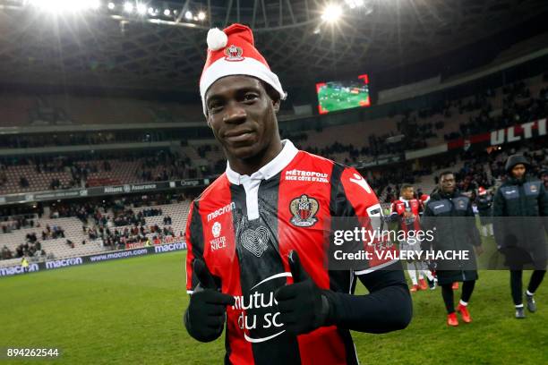 Nice's Italian forward Mario Balotelli celebrates at the end of the French L1 football match Nice vs Bordeaux on December 17, 2017 at the "Allianz...