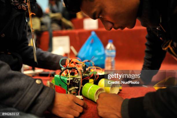 Nepalese students from Team Robo-nec preparing their Robot for Automatic Akhada Yantra 6.0 robotics competition at Army training centre, Lagankhel,...