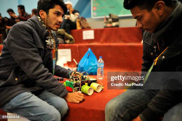 Nepalese students from Team Robo-nec preparing their Robot for Automatic Akhada Yantra 6.0 robotics competition at Army training centre, Lagankhel,...