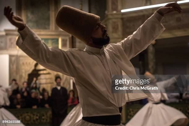 Whirling Dervishes take part in a Sema Prayer Ceremony marking the anniversary of the death of Mevlana Jalal al-Din al-Rumi on December 17, 2017 in...