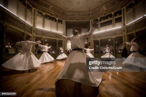 Whirling Dervishes take part in a Sema Prayer Ceremony marking the anniversary of the death of Mevlana Jalal al-Din al-Rumi on December 17, 2017 in...