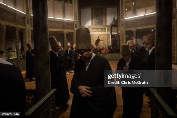 Whirling Dervishes take part in a Sema Prayer Ceremony marking the anniversary of the death of Mevlana Jalal al-Din al-Rumi on December 17, 2017 in...