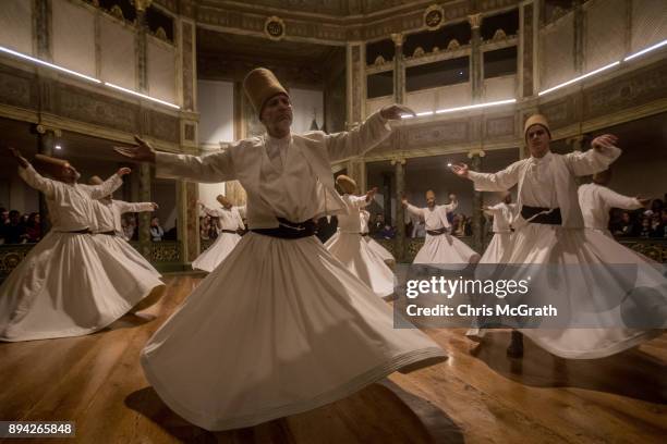 Whirling Dervishes take part in a Sema Prayer Ceremony marking the anniversary of the death of Mevlana Jalal al-Din al-Rumi on December 17, 2017 in...