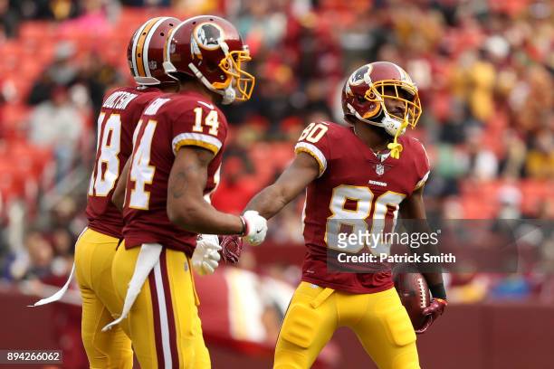Wide Receiver Jamison Crowder of the Washington Redskins walks off the field after scoring a touchdown in the first quarter against the Arizona...