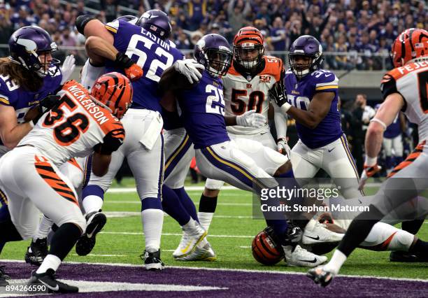 Latavius Murray of the Minnesota Vikings spins into the end zone with the ball for a touchdown in the first quarter of the game against the...