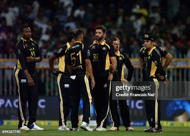 Liam Plunkett celebrates with team mates after dismissing Umar Akmal during the T10 League Final match between Kerela Kings and Punjabi Legends at...