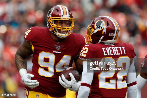 Outside Linebacker Preston Smith and strong safety Deshazor Everett of the Washington Redskins celebrate after recovering a fumble in the first...