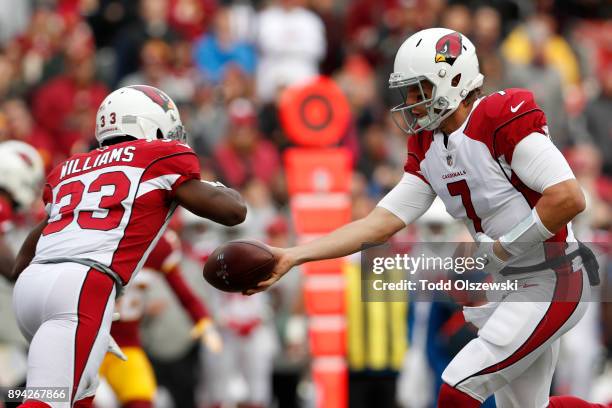 Quarterback Blaine Gabbert hands the ball off to running back Kerwynn Williams of the Arizona Cardinals in the first quarter against the Washington...