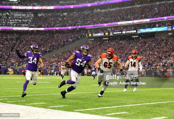 Eric Kendricks of the Minnesota Vikings runs with the ball after intercepting Andy Dalton of the Cincinnati Bengals in the first quarter of the game...