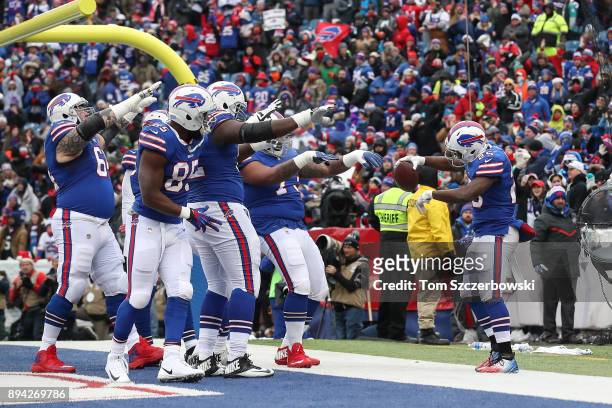 Buffalo Bills celebrate after LeSean McCoy of the Buffalo Bills scored a touchdown during the first quarter against the Miami Dolphins on December...