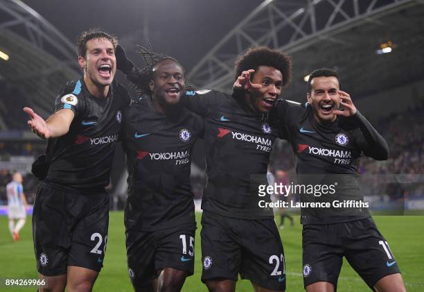 Cesar Azpilicueta, Victor Moses, Willian, and Pedro of Chelsea celebrate the third during the Premier League match between Huddersfield Town and...