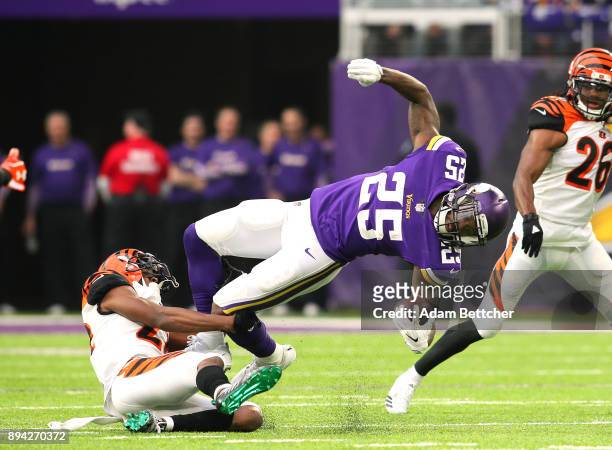Latavius Murray of the Minnesota Vikings is tackled with the ball by William Jackson of the Cincinnati Bengals in the first quarter of the game on...