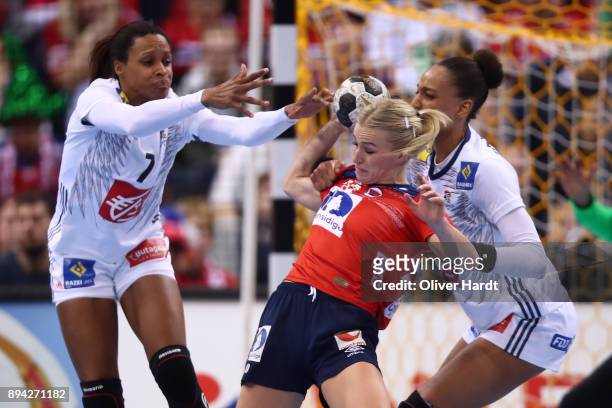 Allison Pineau and Beatrice Edwige of France and Stine Bredal Oftedal of Norway challenges for the ball during the IHF Women's Handball World...