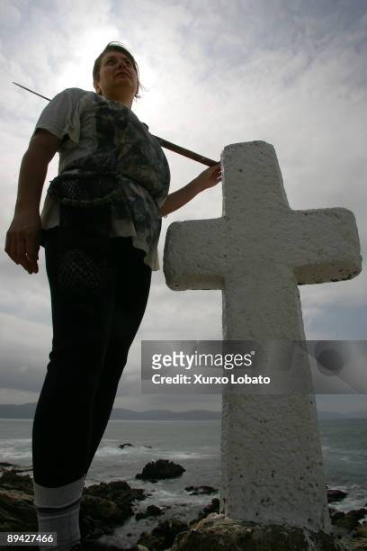Roncudo, Galicia Mari Lista, percebeira, next to a cross that remember to the dead fishermen in O Roncudo.
