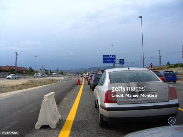 Jams in the autovia N-SAW, highway of The Coruna, Madrid, Spain. Intense traffic, velocity reduced, cars in a tailback.