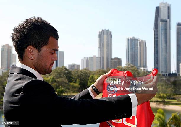 Brisbane Broncos NRL player Karmichael Hunt talks to the media during a press conference to announce that will be switching codes to play AFL for the...