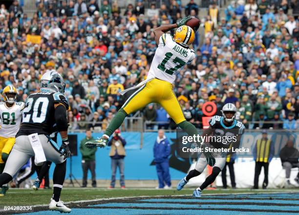 Davante Adams of the Green Bay Packers catches a touchdown pass against the Carolina Panthers in the first quarter during their game at Bank of...