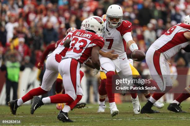 Quarterback Blaine Gabbert hands the ball off to running back Kerwynn Williams of the Arizona Cardinals in the first quarter against the Washington...