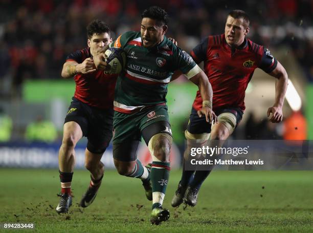 Manu Tuilagi of Leicester Tigers makes a break through the Munster defence during the European Rugby Champions Cup match between Leicester Tigers and...