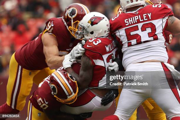 Running Back Kerwynn Williams of the Arizona Cardinals is tackled as he carries the ball in the first quarter against the Washington Redskins at...