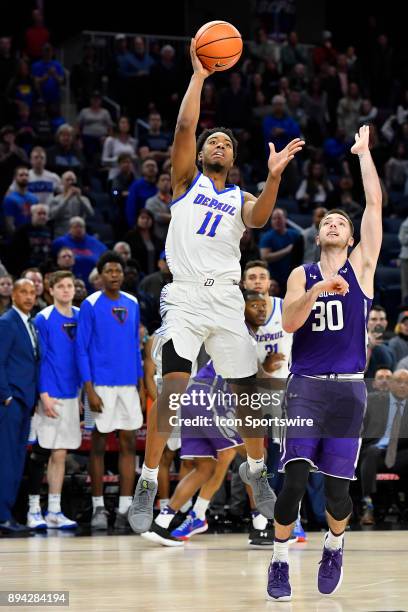 DePaul Blue Demons guard Eli Cain misses the shot at the buzzer to send the game to overtime between the DePaul Blue Demons and the Northwestern...