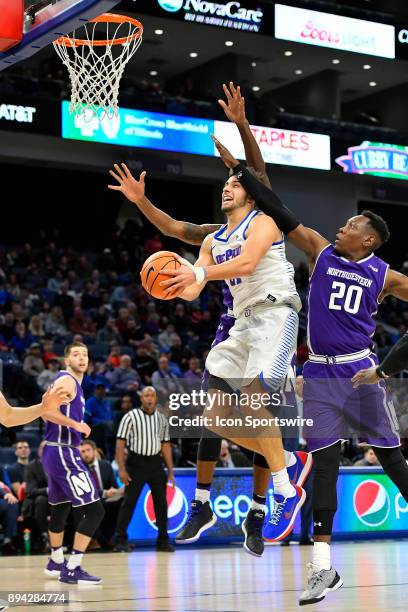 DePaul Blue Demons guard Max Strus is fouled shooting a lay up during the game between the DePaul Blue Demons and the Northwestern Wildcats on...