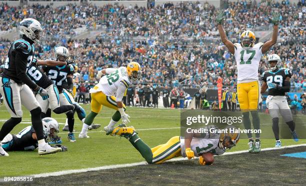 Randall Cobb of the Green Bay Packers dives into the end zone for a touchdown against the Carolina Panthers during their game at Bank of America...