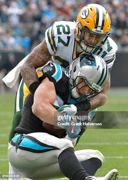 Christian McCaffrey of the Carolina Panthers makes a catch against Josh Jones of the Green Bay Packers during their game at Bank of America Stadium...