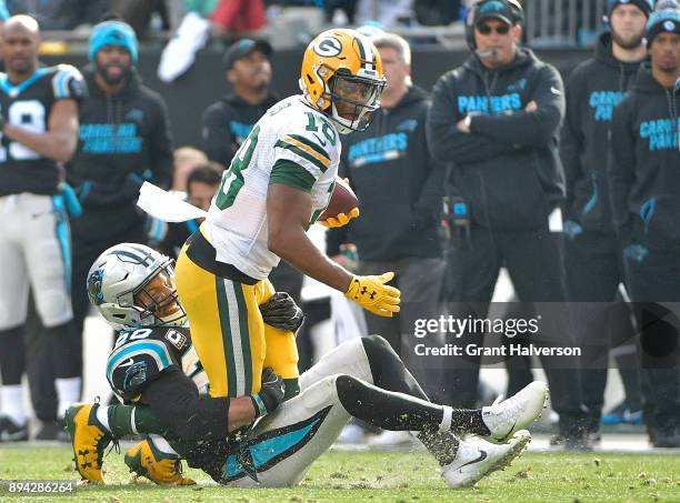 Randall Cobb of the Green Bay Packers makes a catch against Kurt Coleman of the Carolina Panthers during their game at Bank of America Stadium on...