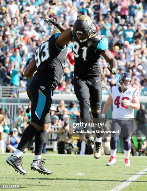 Calais Campbell and Yannick Ngakoue of the Jacksonville Jaguars celebrate a play during the second half of their game against the Houston Texans at...