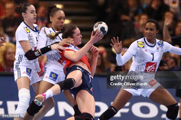 Camille Ayglon Saurina and Beatrice Edwige of France and Kari Brattset of Norway challenges for the ball during the IHF Women's Handball World...
