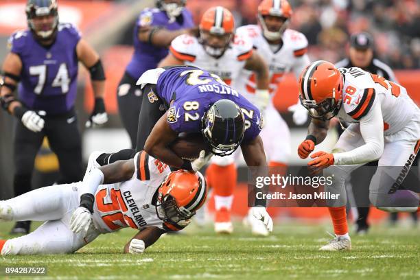 Benjamin Watson of the Baltimore Ravens is tackled by Deon King of the Cleveland Browns in the first half at FirstEnergy Stadium on December 17, 2017...