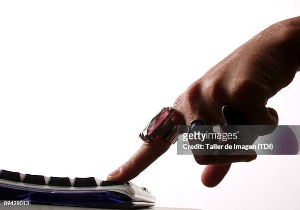 Woman's finger pressing a keyboard