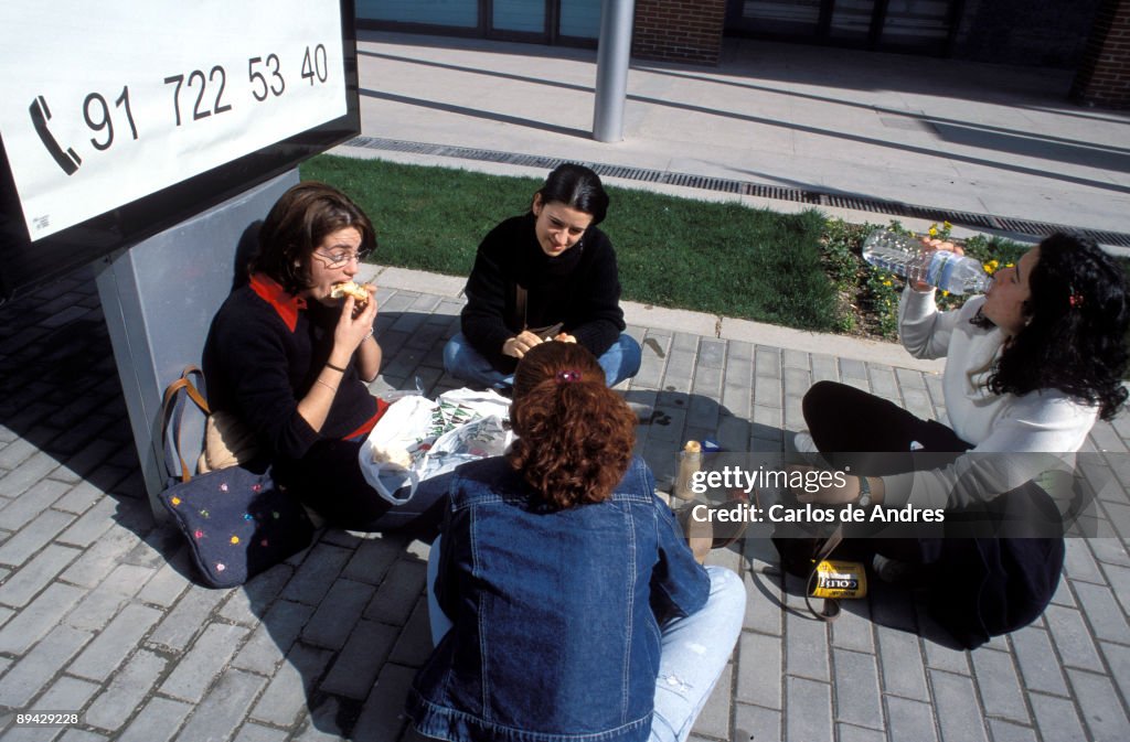 Madrid, Spain. Young people eating sandwich.