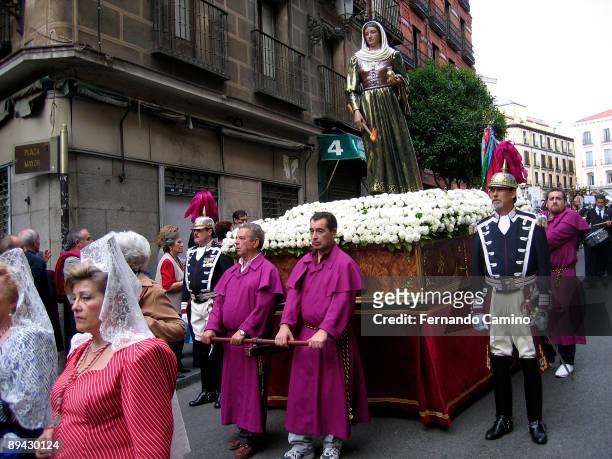 Madrid, Spain. Procession along the streets of Madrid in San Isidro Labrador festivity, the saint of Madrid. In the image, the faithful carry the...