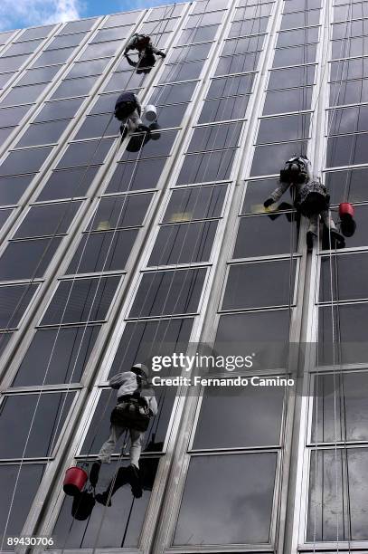 Window washers at work in an office building, Madrid .