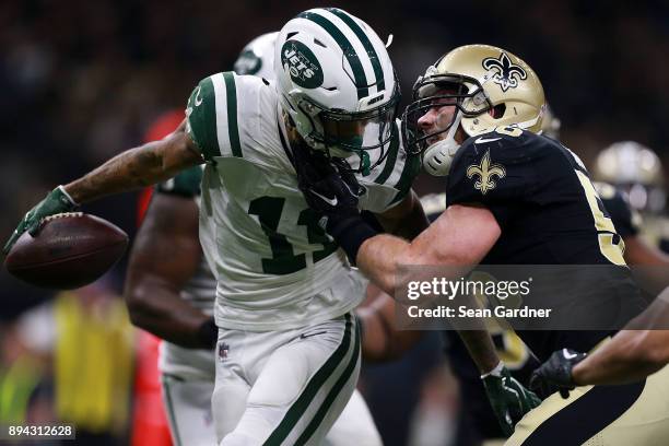 Wide receiver Robby Anderson of the New York Jets is tackled by linebacker Michael Mauti of the New Orleans Saints during the first half of a game at...