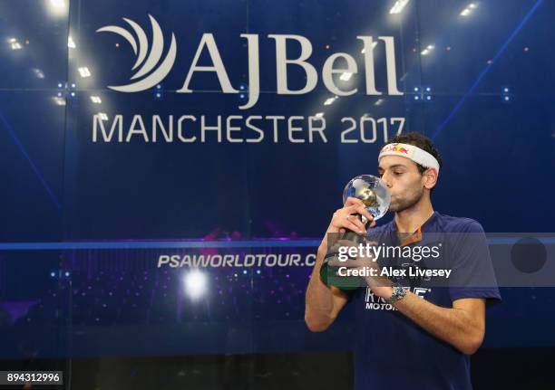 Mohamed ElShorbagy of Egypt holds aloft the AJ Bell PSA World Squash Championships trophy after victory over his brother Marwan ElShorbagy of Egypt...