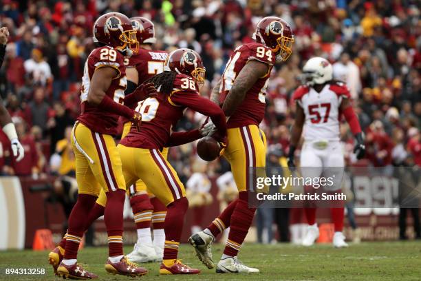 Outside Linebacker Preston Smith, cornerback Kendall Fuller and free safety D.J. Swearinger of the Washington Redskins celebrate after an...
