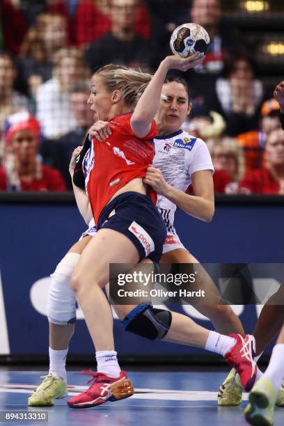 Camille Ayglon Saurina of France and Heidi Loke of Norway challenges for the ball during the IHF Women's Handball World Championship final match...