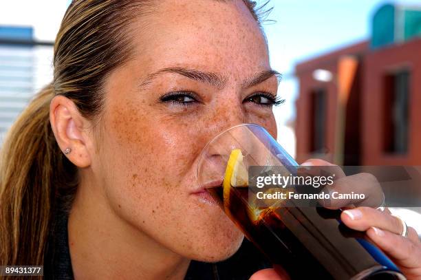 Girl drinking a coke.