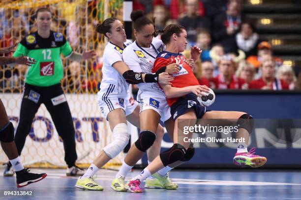 Camille Ayglon Saurina and Beatrice Edwige of France and Kari Brattset of Norway challenges for the ball during the IHF Women's Handball World...