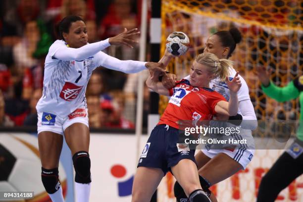 Allison Pineau and Beatrice Edwige of France and Stine Bredal Oftedal of Norway challenges for the ball during the IHF Women's Handball World...