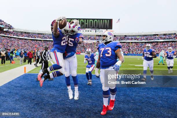 Buffalo Bills celebrate after LeSean McCoy of the Buffalo Bills scored a touchdown during the second quarter against the Miami Dolphins on December...