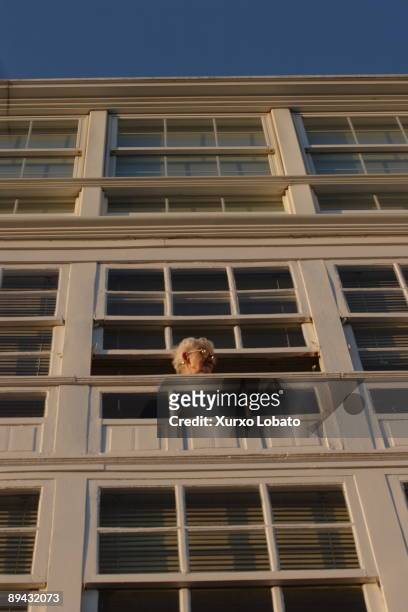Galicia. Betanzos. Woman in a window