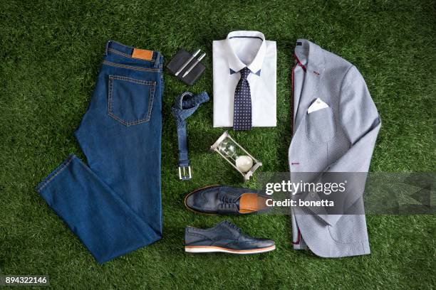 men’s clothing isolated on grass background - bolso imagens e fotografias de stock