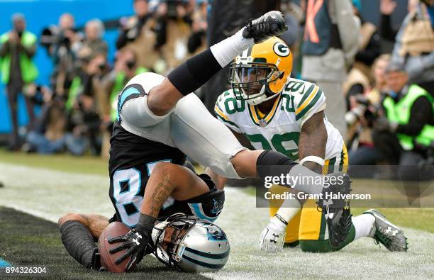 Damiere Byrd of the Carolina Panthers catches a touchdown pass against Josh Hawkins of the Green Bay Packers in the third quarter during their game...